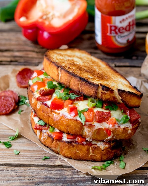 Close-up of a sizzling pepperoni pizza grilled cheese sandwich