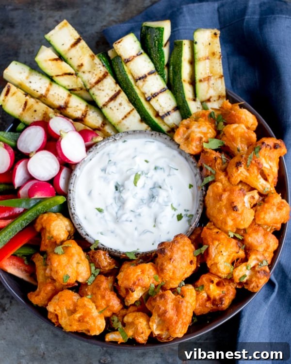 baked-buffalo-cauliflower-wings-3.jpg Baked buffalo cauliflower wings with ranch dip and fresh vegetables