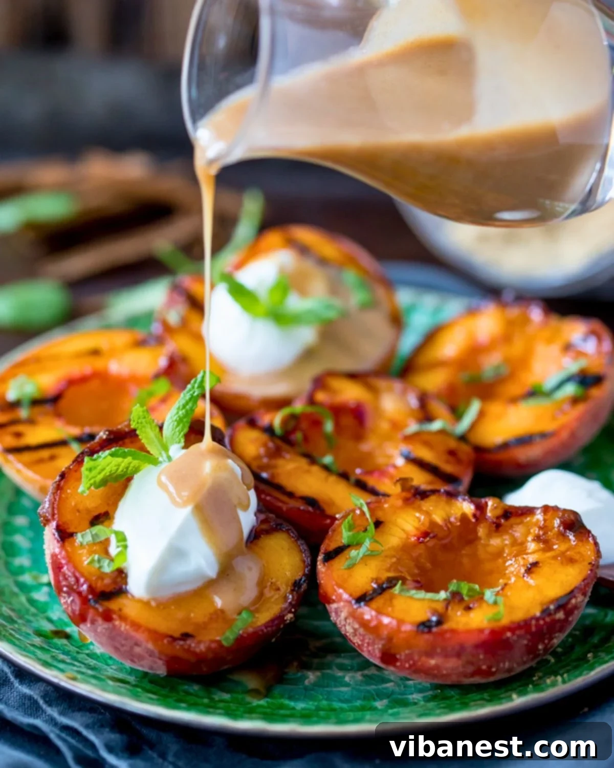 Smoky Sweet Grilled Peaches with Cinnamon Caramel Glaze 4 grilled peaches with beautiful grill marks cooling on a wire rack