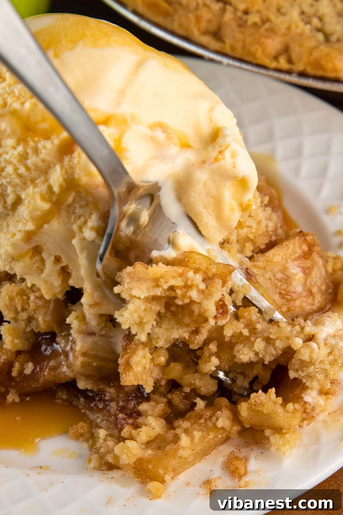 Golden Apple Streusel Pie 3 Freshly baked apple pie with golden brown crumb topping, cooling on a rack