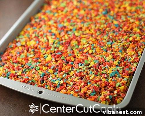 Detailed View of Colorful Rainbow Rice Krispie Pinwheels Close-up photo of several Rainbow Rice Krispie Pinwheels, showcasing their colorful swirls and creamy frosting layers