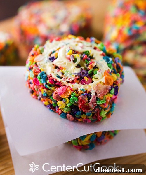 Stack of Delicious Rainbow Rice Krispie Pinwheels A stack of beautifully arranged Rainbow Rice Krispie Pinwheels, showcasing their appealing colors and frosting layers