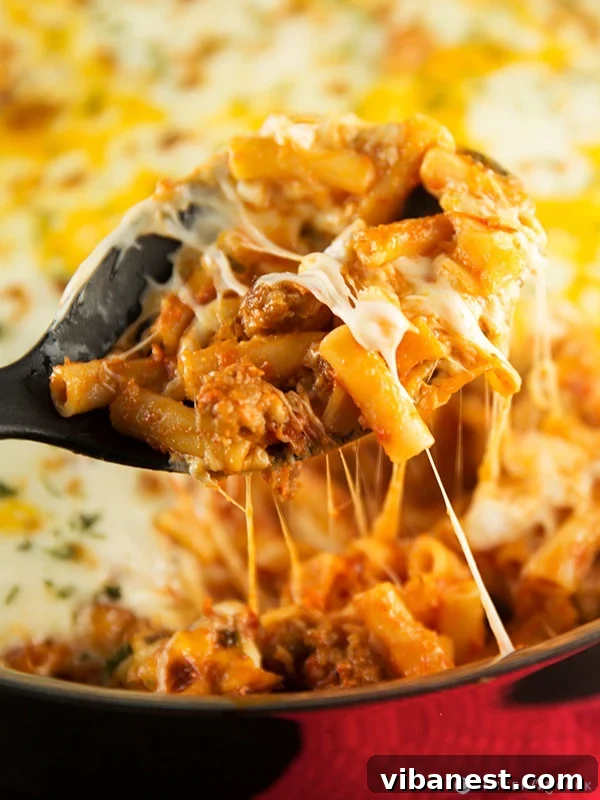 Skillet Baked Ziti Perfection Close-up of a bubbling, cheesy Skillet Baked Ziti dish, fresh from the oven