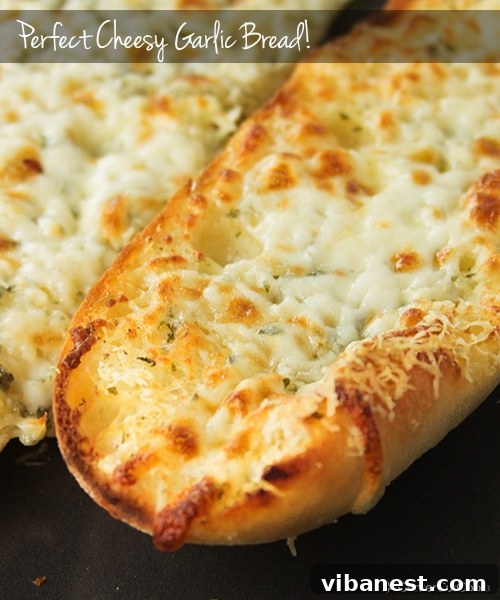 Cheesy Garlic Bread for All Golden brown and cheesy garlic bread slices arranged on a cutting board, ready to serve