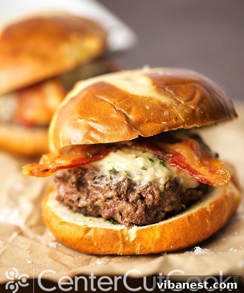 Bacon Parmesan Garlic Burger ready to eat Finished Bacon Parmesan Garlic Burger on Pretzel Bun