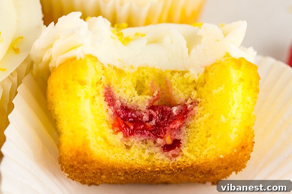 lemon-cupcakes-raspberry-jam-filling-4.jpg Close-up of Lemon Cupcakes with Jam Filling