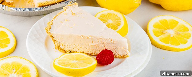 Pink Lemonade Pie Slices Artistically arranged slices of frozen pink lemonade pie, topped with berries and mint