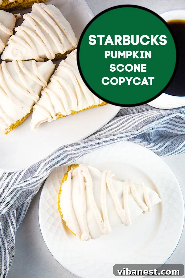 Close-up of a perfectly baked homemade Starbucks Pumpkin Scone copycat, showing its crumbly texture and glaze