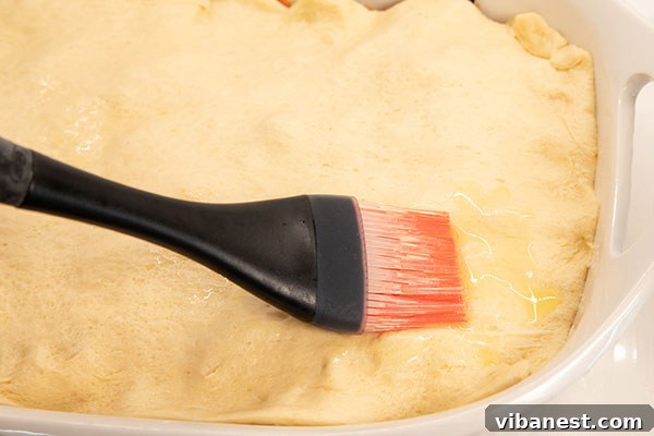 Crescent Roll Topping for Pizza Casserole Crescent roll sheet placed on top of pizza casserole
