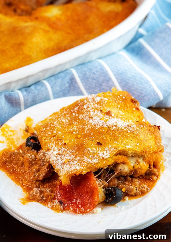 Upside Down Pizza Casserole Serving Serving of upside down pizza casserole on a plate