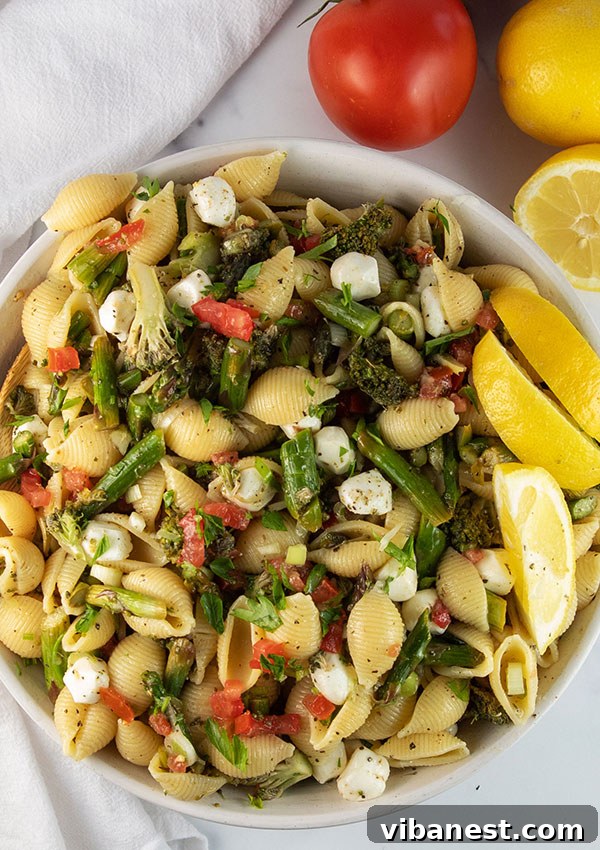 roasted-vegetable-pasta-salad-5.jpg Final plated roasted vegetable pasta salad with a fork
