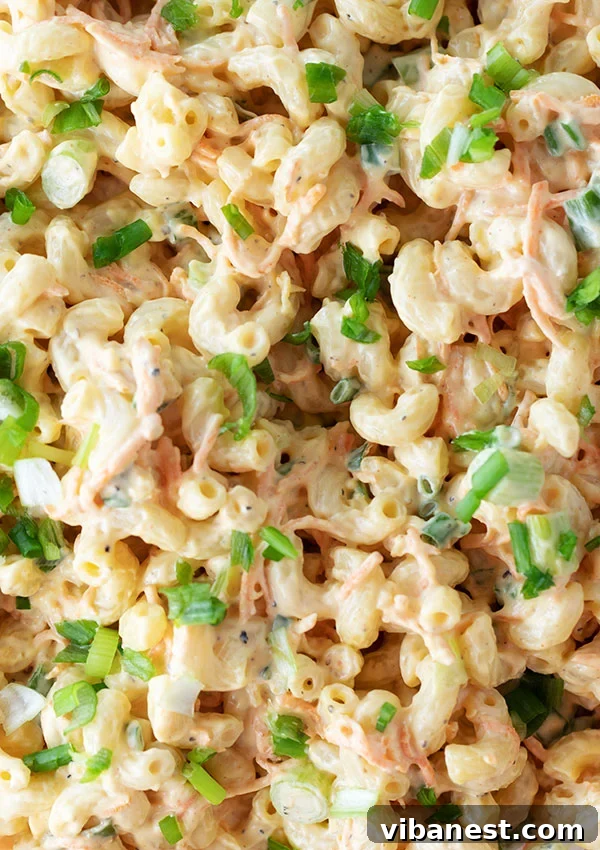 hawaiian-macaroni-salad-6.jpg Hawaiian Macaroni Salad on a plate with grilled meat