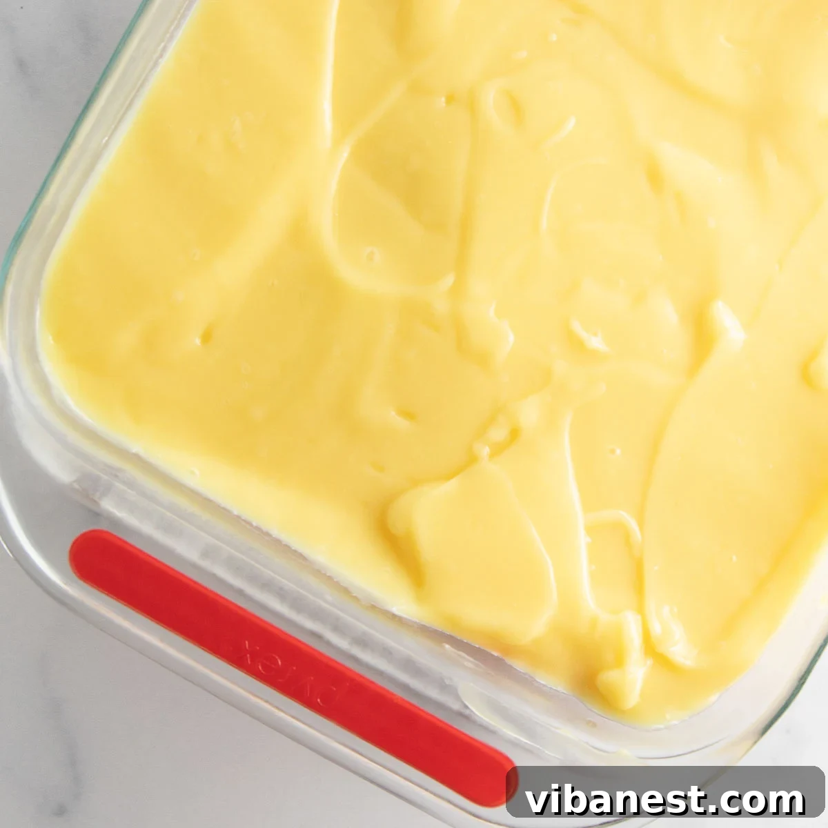 Strawberry Layered Delight 11 spreading the pudding layer over cheesecake layer