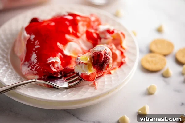 Strawberry Layered Delight 14 plate of strawberry lasagna with a bite on a fork
