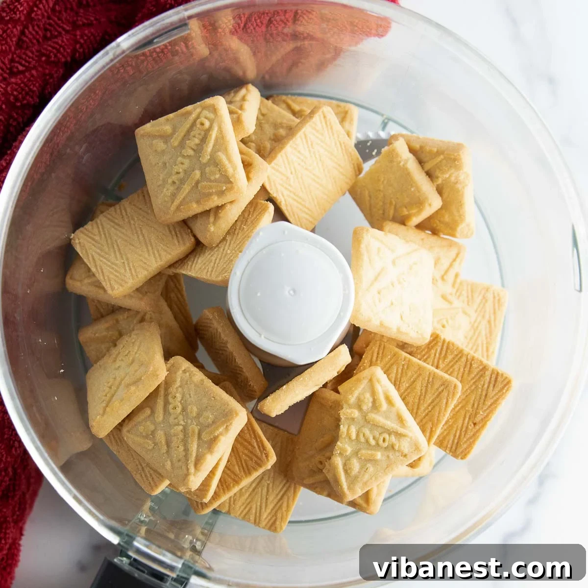 Strawberry Layered Delight 6 Crushing Lorna Doone cookies in a food processor for dessert crust.