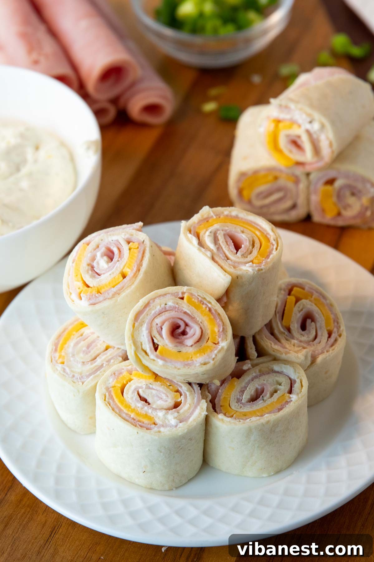 Savory Ham and Cheese Swirls 2 ham and cheese pinwheels on a plate