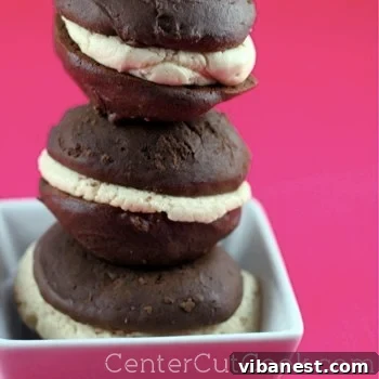 Close-up of a stack of Chocolate Peanut Butter Whoopie Pies with creamy filling, ready to eat