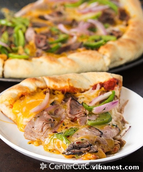 Freshly Baked Philly Cheesesteak Pizza Close-up of baked Philly Cheesesteak Pizza with melted cheese and toppings