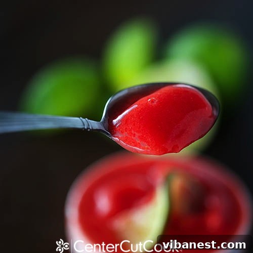 Achieving Smooth Sorbet Texture with Vitamix Close-up view of freshly blended strawberry lime sorbet in a Vitamix container, showcasing its incredibly smooth and uniform texture before serving