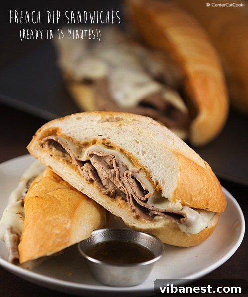 Close-up of a homemade French Dip sandwich with a side of au jus