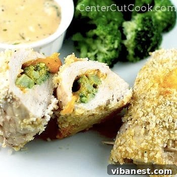 Close-up of baked Broccoli and Cheese Stuffed Chicken with cheese sauce