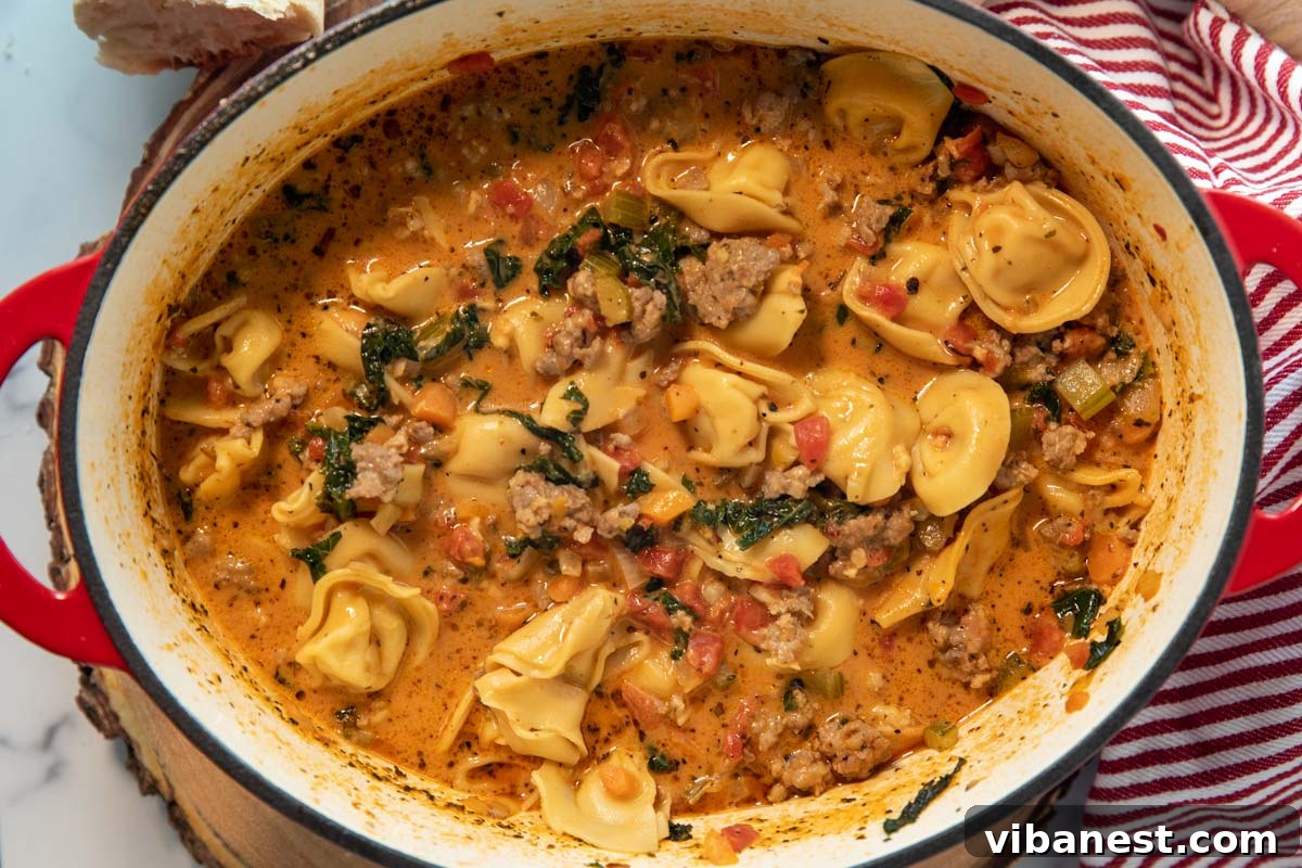 Fiery Italian Sausage Tortellini Soup 3 Overhead shot of a pot of spicy tortellini soup simmering, ready to be served.