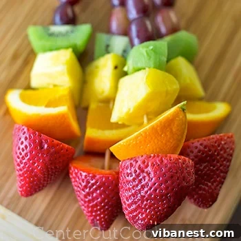 Rainbow fruit kabobs arranged beautifully on a plate, ready to serve