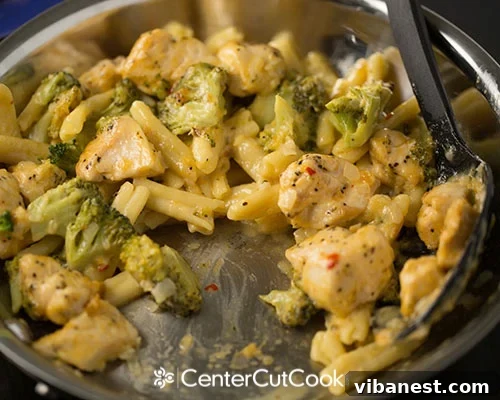 Cheddar, Broccoli and Chicken Skillet 5.jpg Close-up of cheddar cheese melting into the pasta sauce