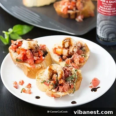 Final plated grilled shrimp bruschetta with fresh garnish