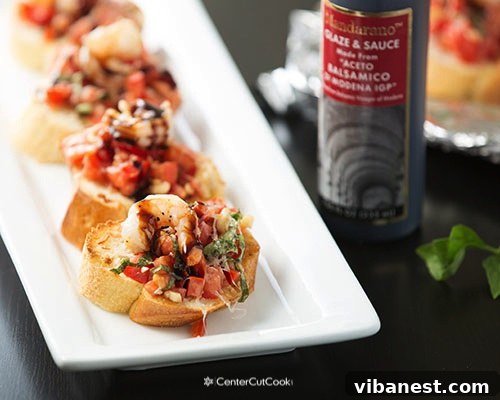 Bruschetta Before Broiling Bruschetta topped with tomato, mozzarella, and shrimp, ready for the oven