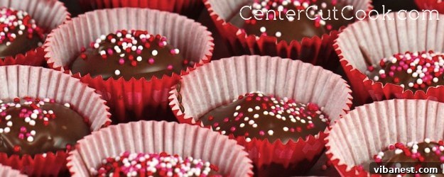Delicious homemade peanut butter cups with a chocolate and creamy peanut butter filling, topped with festive sprinkles.
