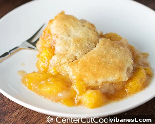 fresh peach cobbler 3.jpg Fresh peach cobbler with a rustic charm, highlighting its golden crust and juicy filling.