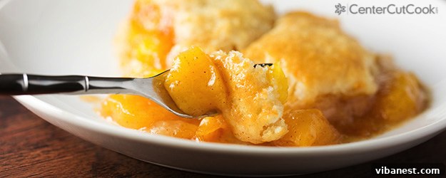 fresh peach cobbler.jpg A large rectangular baking dish of fresh peach cobbler, ready to be scooped and served.