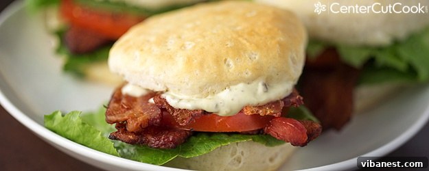 Delicious BLT Biscuits with crispy bacon, fresh lettuce, juicy tomatoes, and pesto mayo, perfect for a quick and flavorful meal.