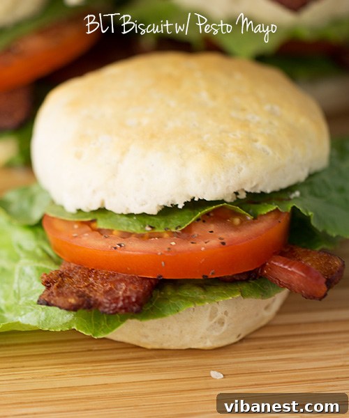Assembled BLT Biscuits Artfully arranged BLT Biscuits on a rustic wooden board, showcasing their golden biscuits and colorful fillings.
