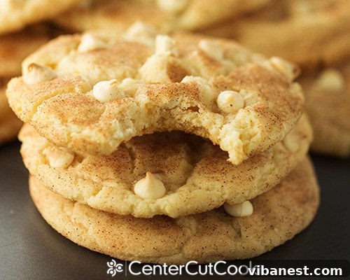 White Chocolate Chip Snickerdoodle Cookies close up A stack of golden brown White Chocolate Chip Snickerdoodle Cookies, dusted with cinnamon sugar