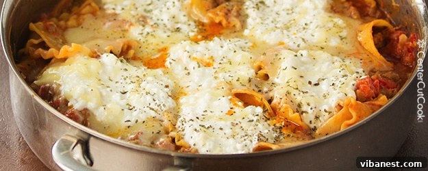 Delicious and Spicy Skillet Lasagna bubbling in a pan, ready to serve.