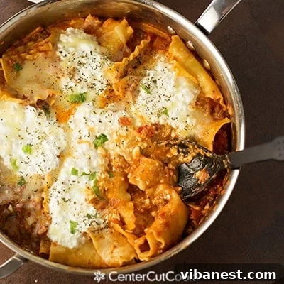Spicy Skillet Lasagna Finished Product Spicy Skillet Lasagna simmering in a pan with fresh basil garnish.