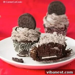 Chocolate Oreo Cupcakes with Cookies & Cream Frosting on a plate, ready to be enjoyed.