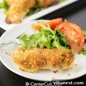 Crispy Parmesan Chicken 3 Parmesan Crusted Chicken on a plate with salad
