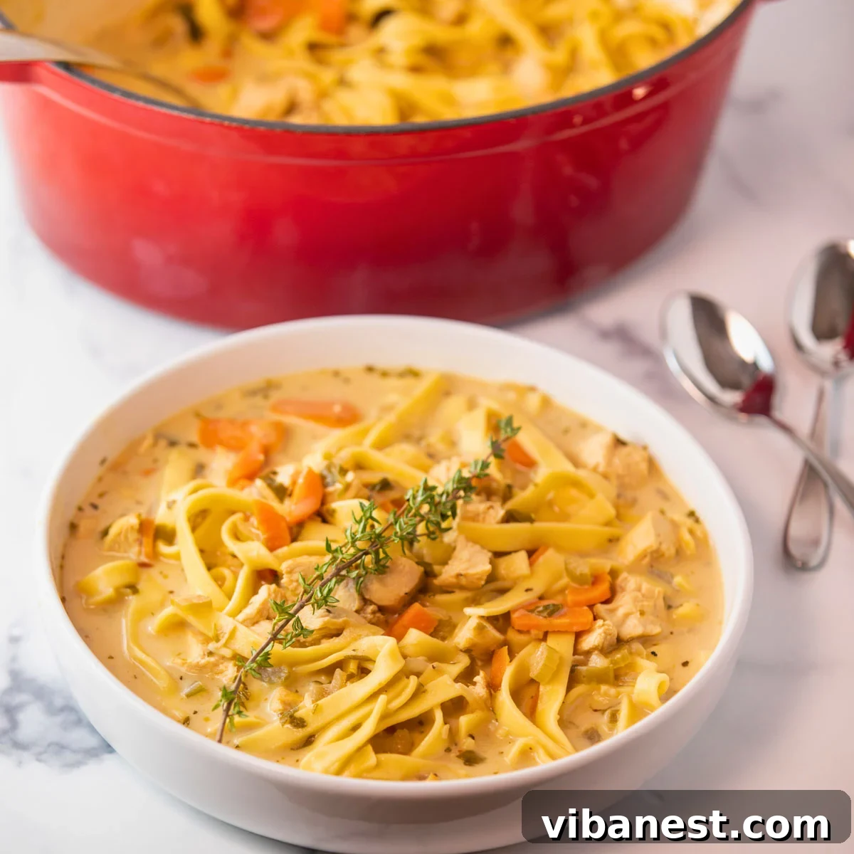 Friday's Five Picks 3 bowl of creamy chicken noodle soup. Pot of soup sitting in background