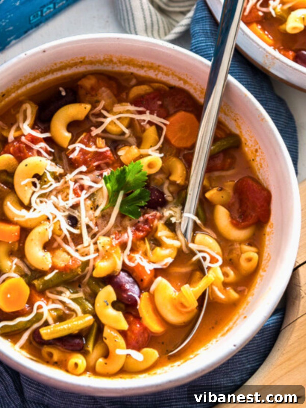 Quick and Delicious Instant Pot Minestrone 3 A beautiful bowl of homemade minestrone soup, garnished with fresh herbs and a drizzle of olive oil