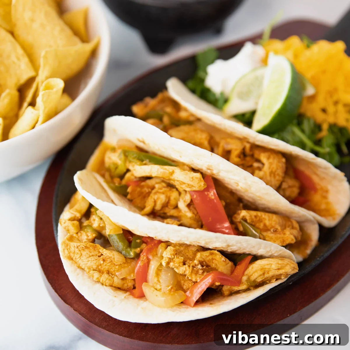 Speedy Instant Pot Chicken Fajitas 2 Vibrant Instant Pot Chicken Fajitas ready to serve on a platter