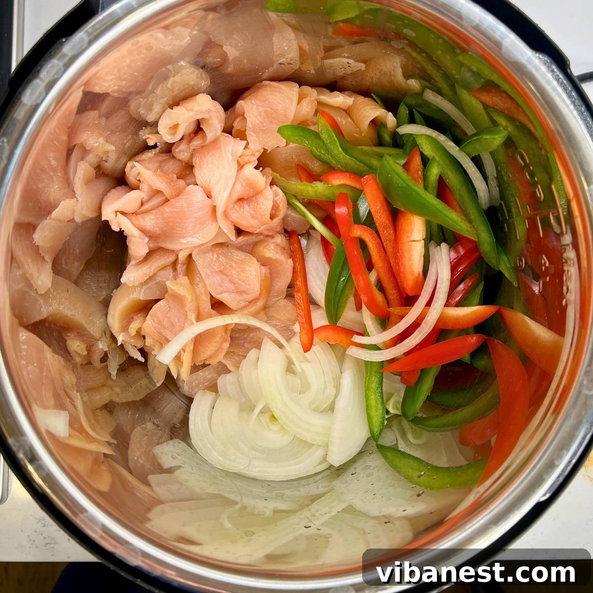 Speedy Instant Pot Chicken Fajitas 5 Close-up showing how to cut chicken breasts into thin strips for fajitas