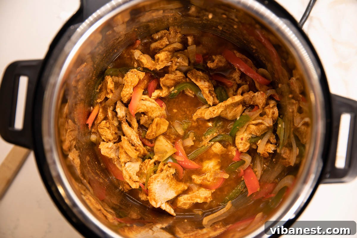 Speedy Instant Pot Chicken Fajitas 4 Overhead view of an Instant Pot filled with perfectly cooked chicken fajitas