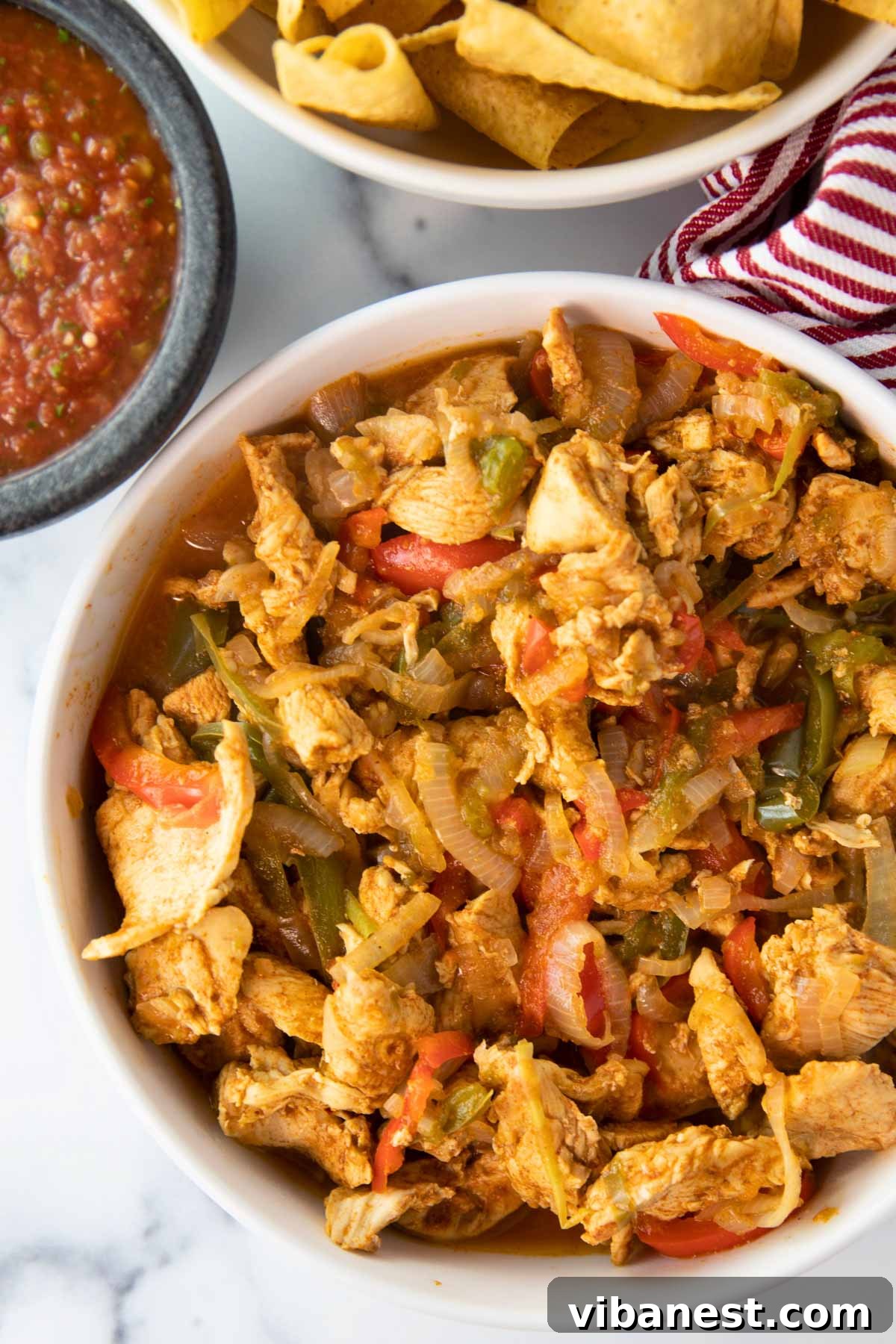 Speedy Instant Pot Chicken Fajitas 6 Overhead shot of Instant Pot chicken fajitas served on a platter with fresh lime