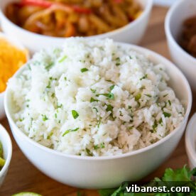 A bowl of fluffy Instant Pot cilantro lime rice, garnished with fresh cilantro, ready to be served.
