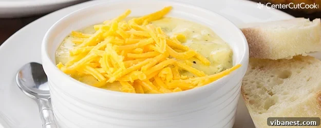 broccoli cheese soup.jpg Delicious and hearty broccoli cheese soup, garnished with fresh herbs and served with bread.