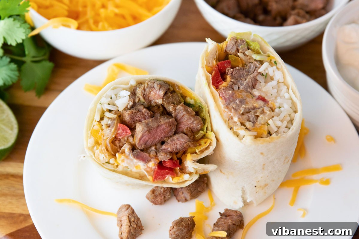 Simple Steak Burrito Delight 7 A delicious easy steak burrito presented on a plate, surrounded by bowls of fresh toppings.