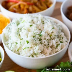A bowl of fresh Instant Pot cilantro lime rice, garnished with vibrant green cilantro.